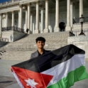 Omar holding the Jordanian flag at the US Capitol