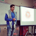 Nassim gives a presentation to a classroom of students about Palestine. 