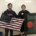 Prottay and friend holding American and Bangladeshi flags