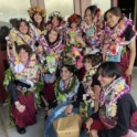 A Group Of Young People Pose Wearing Hawaiin Leis 2