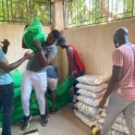 Alumnus Carrying A Bag Of Rice To Prepare For Less Fortunate During Ramadan