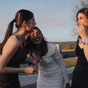 Amna laughing with friends at prom. 