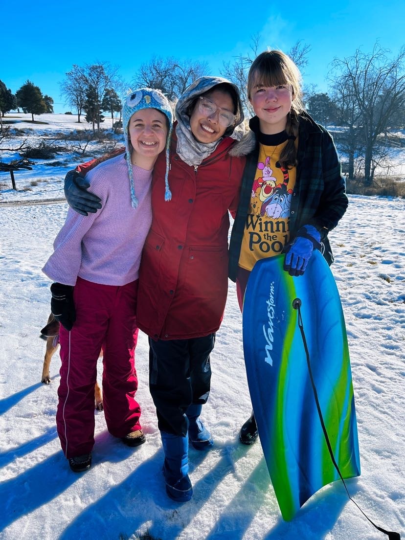 YES student Inam with her American friends sledding