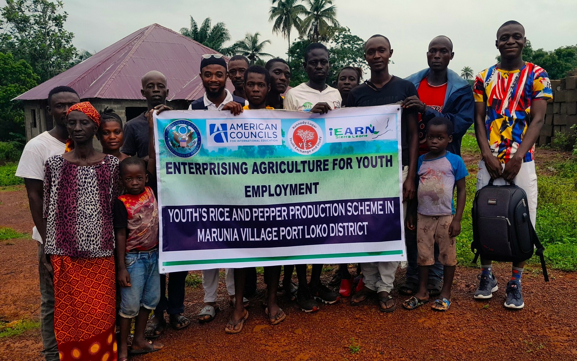 A Group Photo Of Some Of The Participants And Their Children After The Agripreneurship Conference They Are Holding A Poster