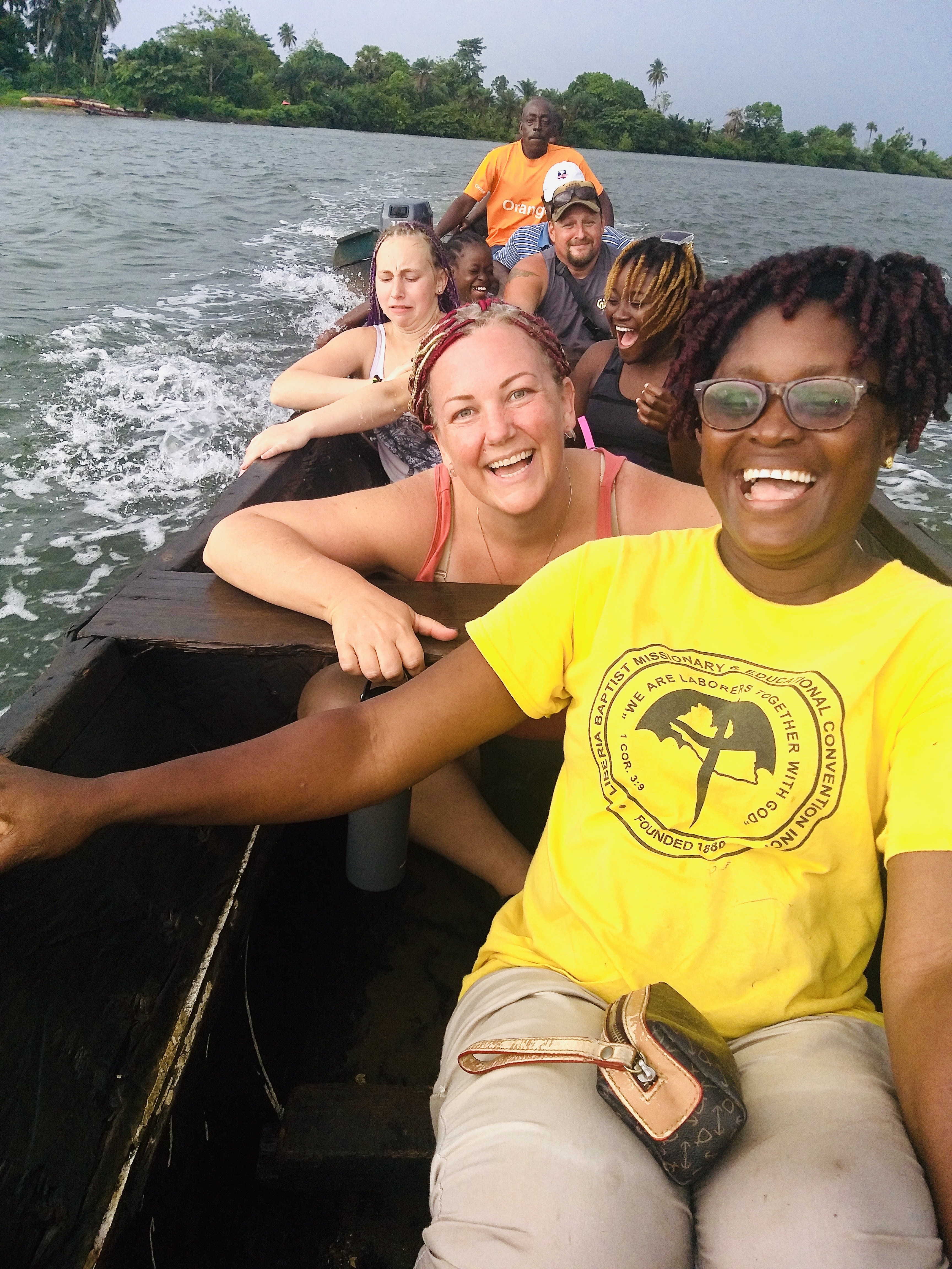 Antoinette taking her host family for a boat ride in Liberia