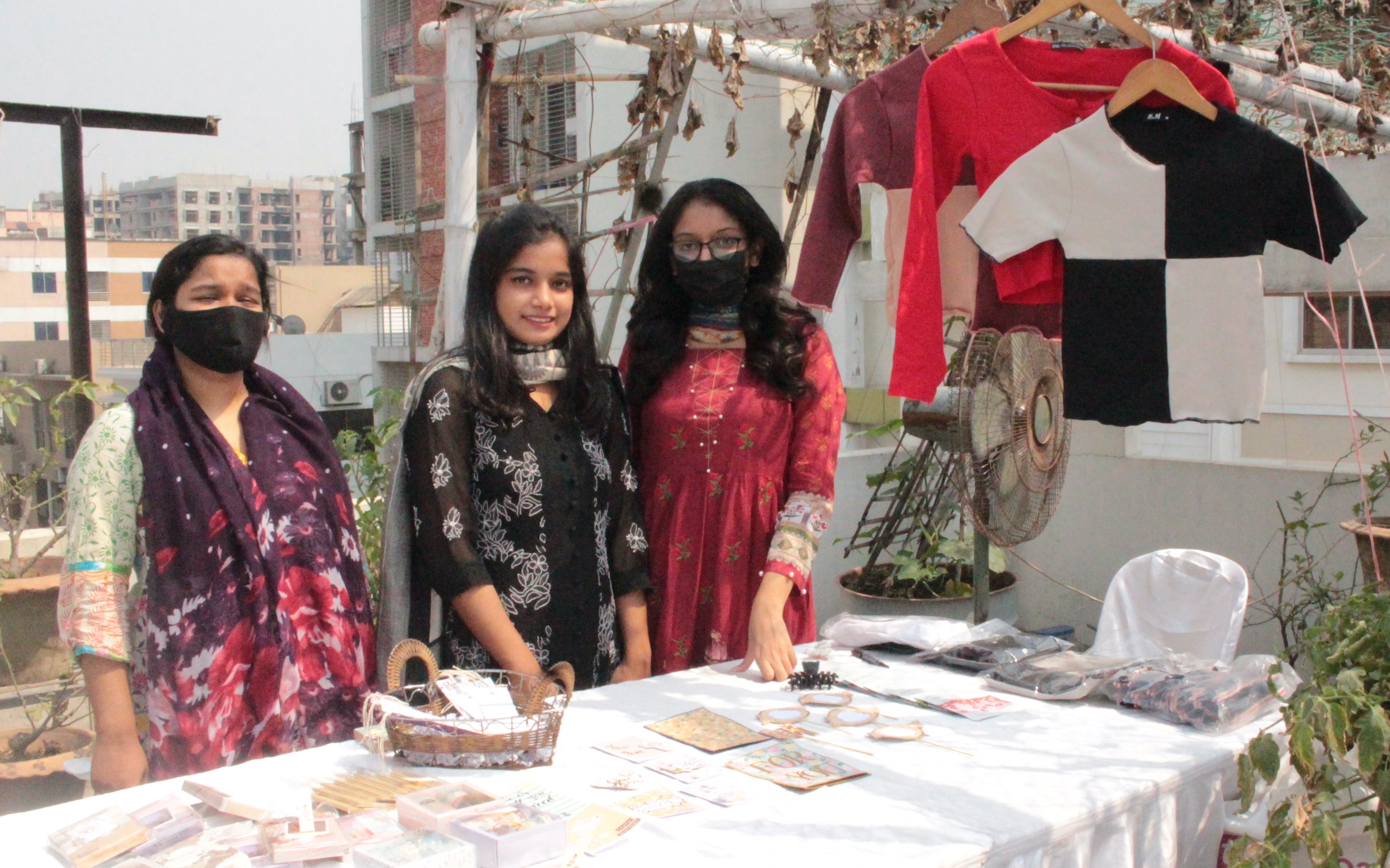 Several of the stall owners showcasing their products on tables
