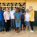 Antoinette's Liberian family and host family standing outside