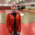 YES student smiles on wrestling mat