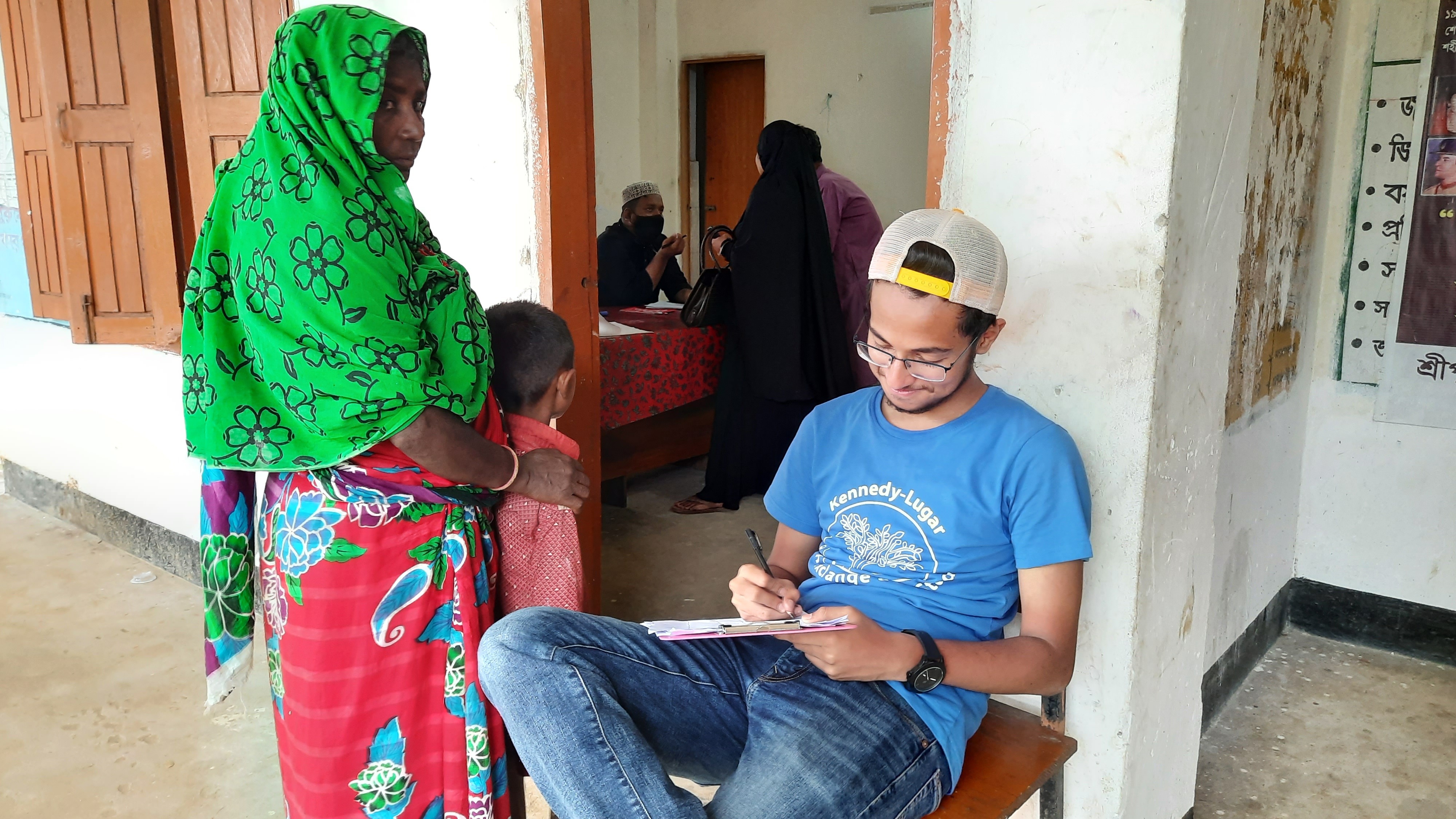 An alumnus checks patients into the flood relief medical camp. 