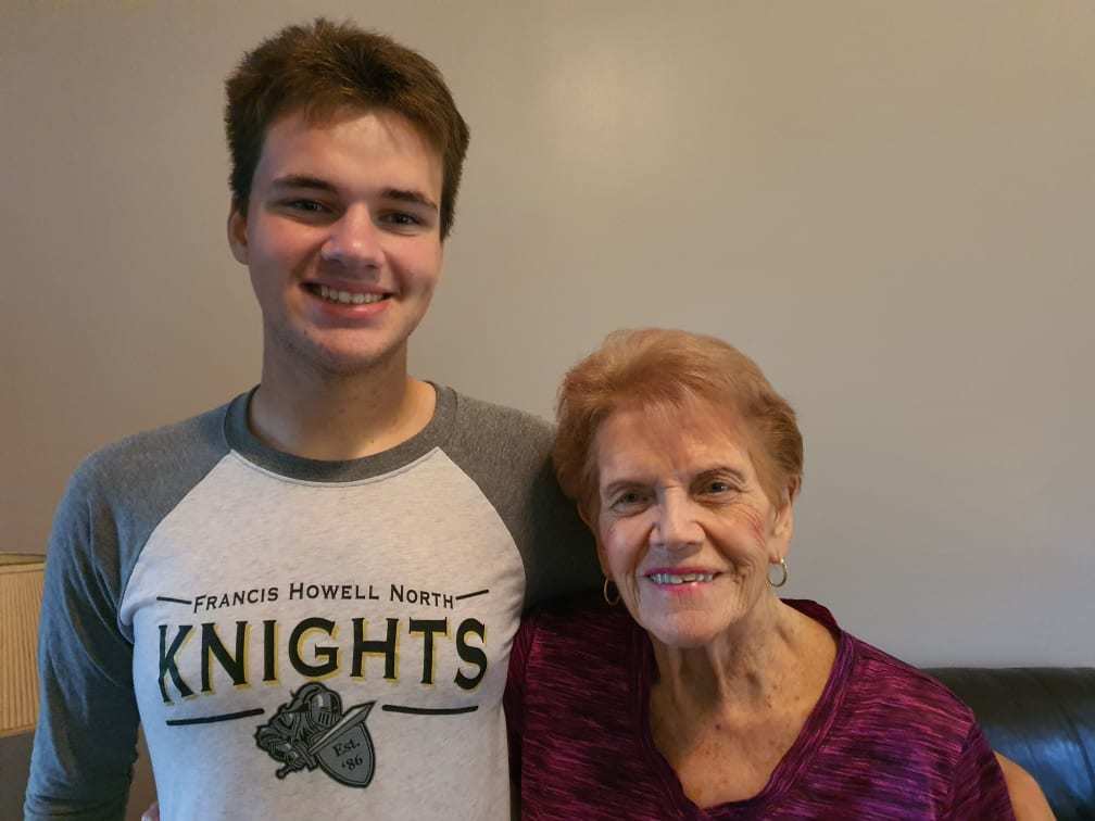 YES student standing next to his host grandma, smiling