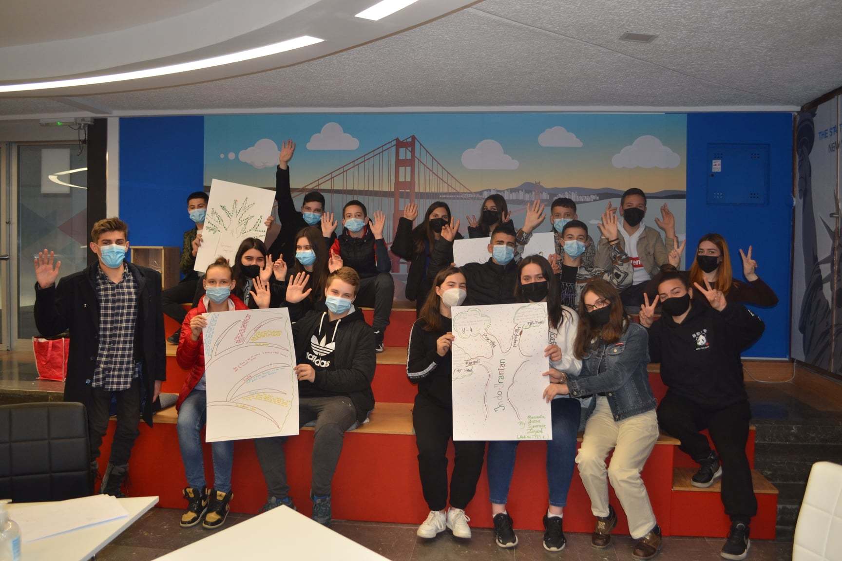 Group of students who participated in the event are holding posters highlighting different languages of the world