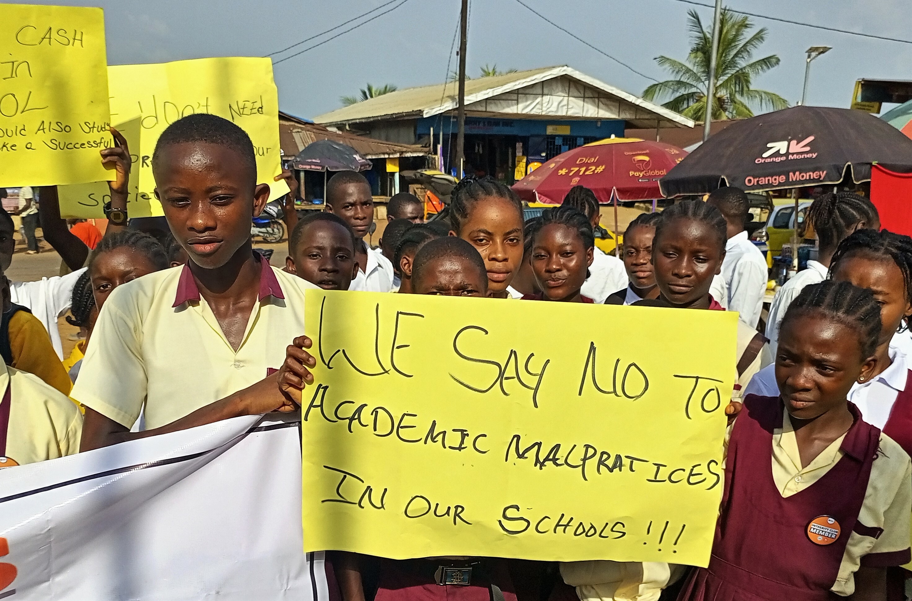 A Group Of Integrity Club Members Outside During A Public Awareness Campaign With Banner That Says We Say No To Academic Malpractice