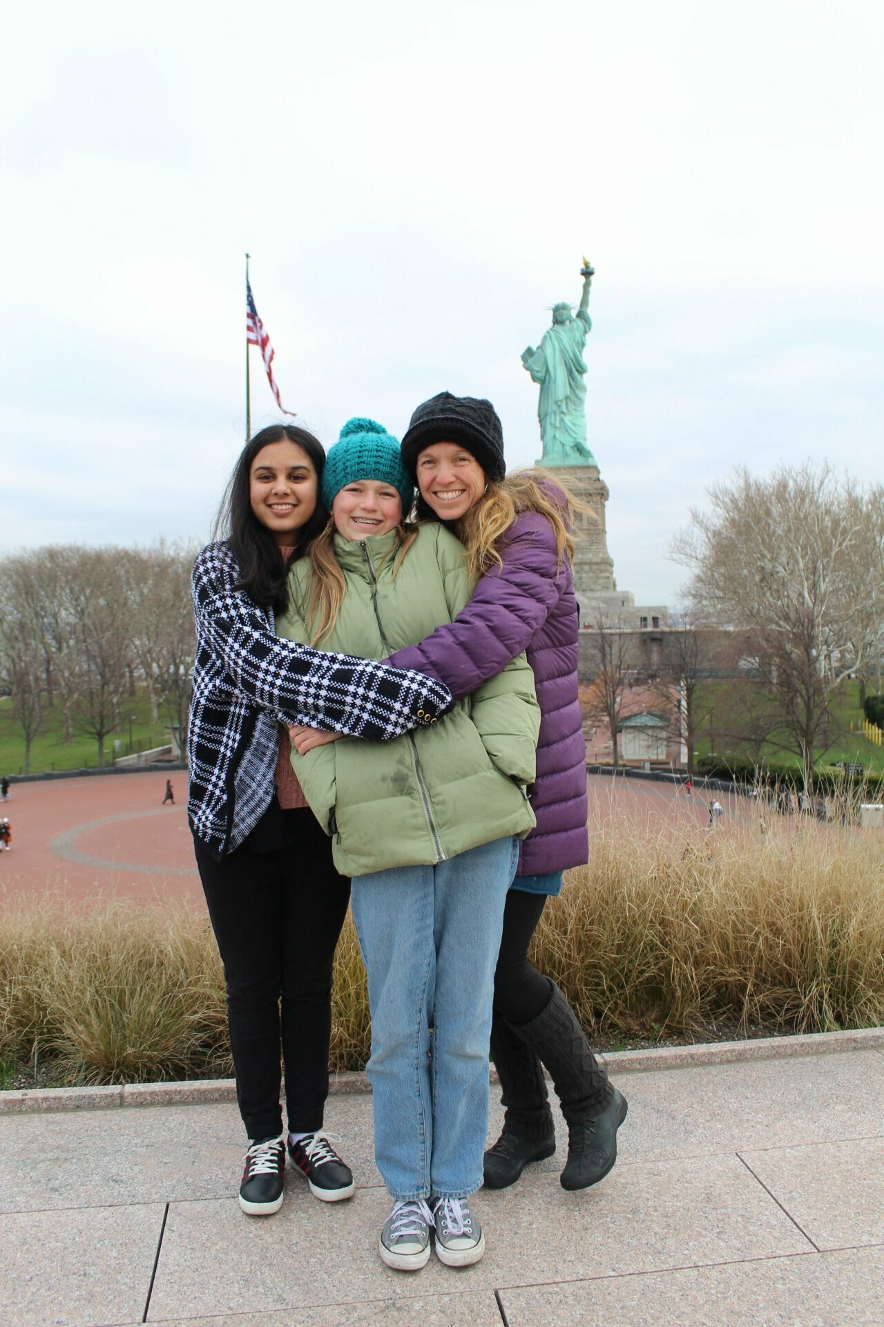 Aleeza at the Statue of Liberty with her host family.