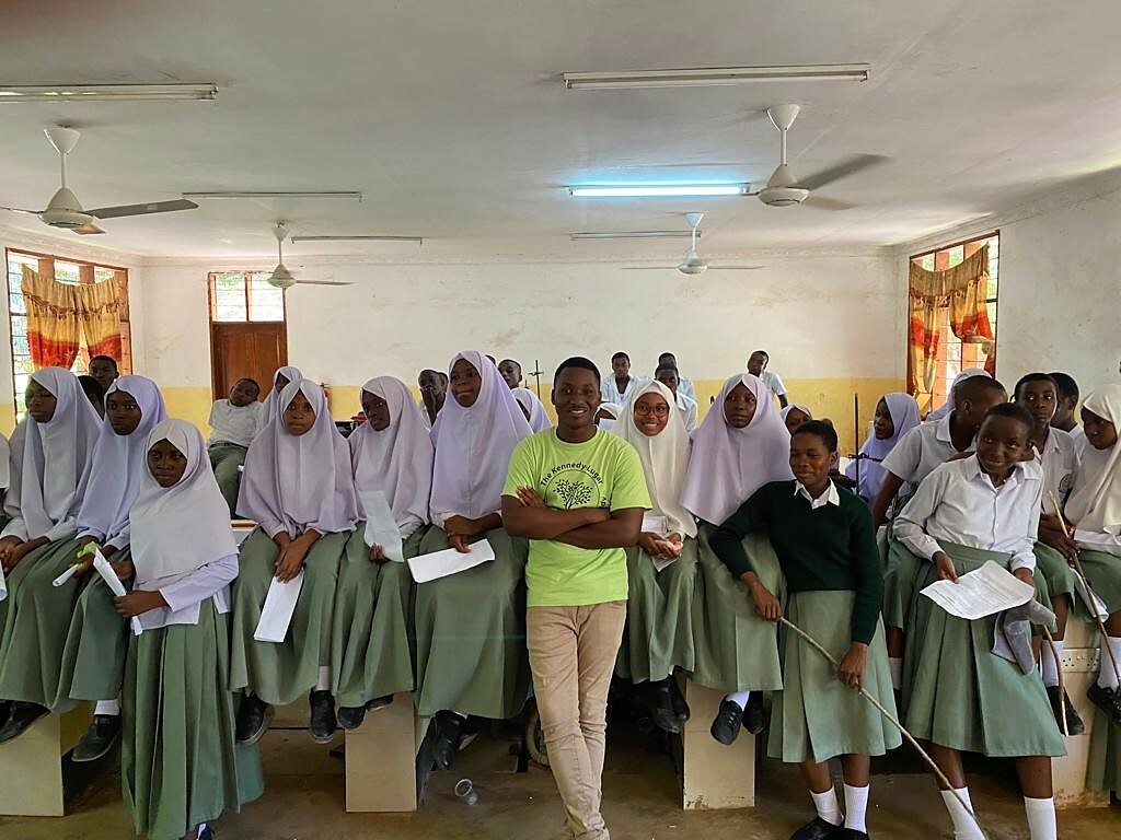 Alumnus From Tanzania Poses With A Group Of Girls After Encouraging Them To Pursue Careers In Stem