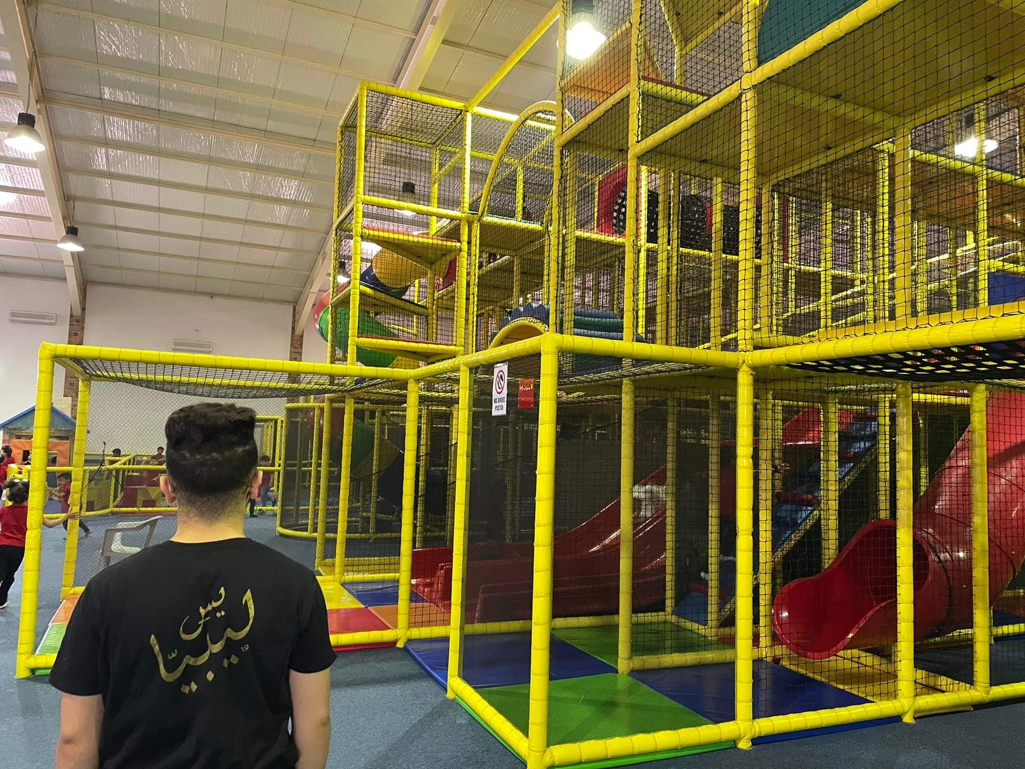 A student looks at a jungle gym