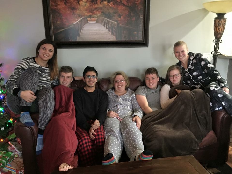 Mudda spending Christmas morning with his host family and friends