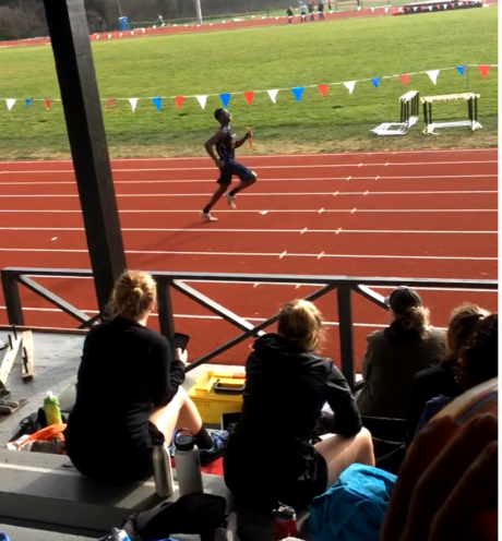 Abraham running a race on the track field