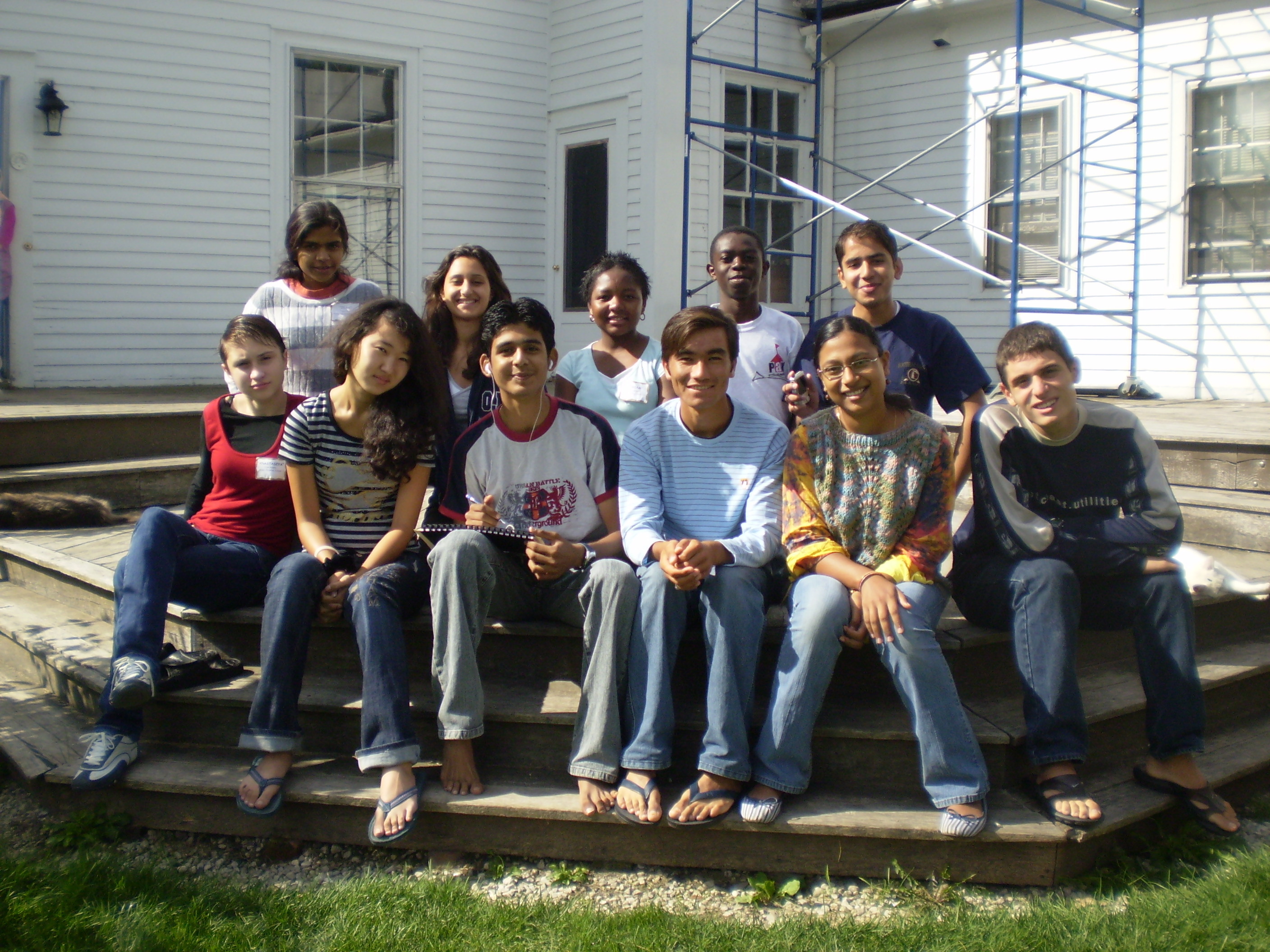 Group Of Students Posed Sitting On Steps
