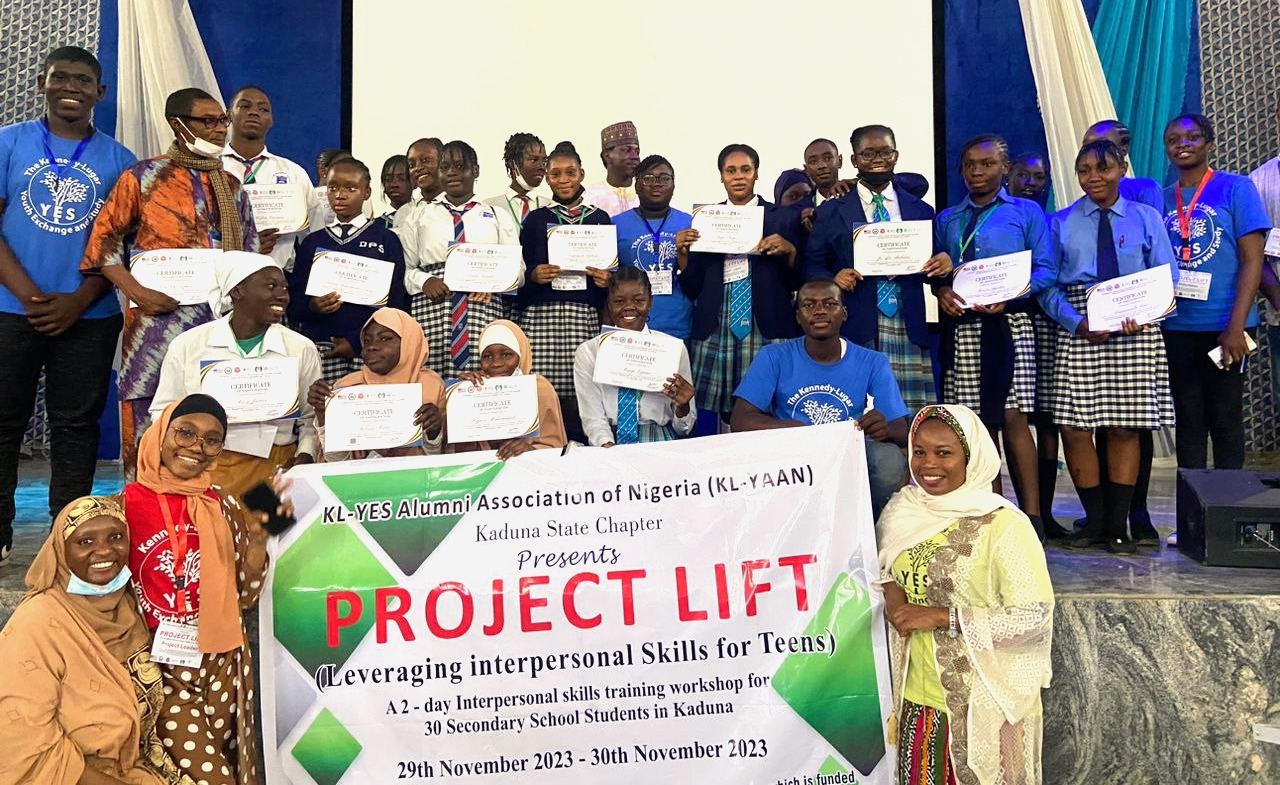 Group photo with certificates and project poster