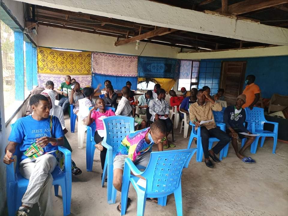 Participants sitting inside a classroom at a skills training session.