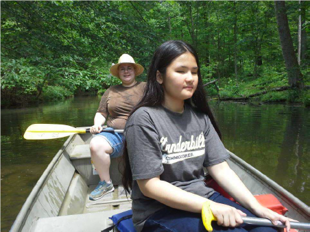 Celine and her host family canoeing 