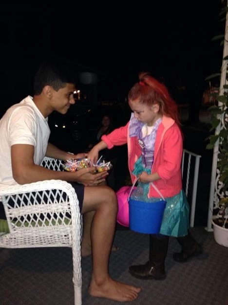 Mohammad giving out candy on halloween