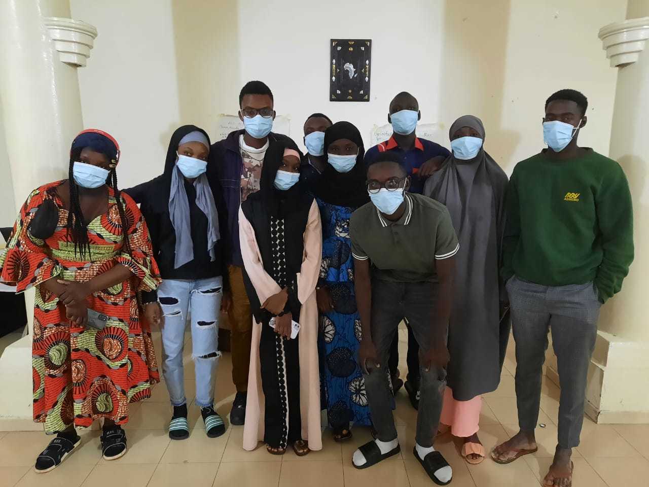Malian students wearing masks, posing for a group photo
