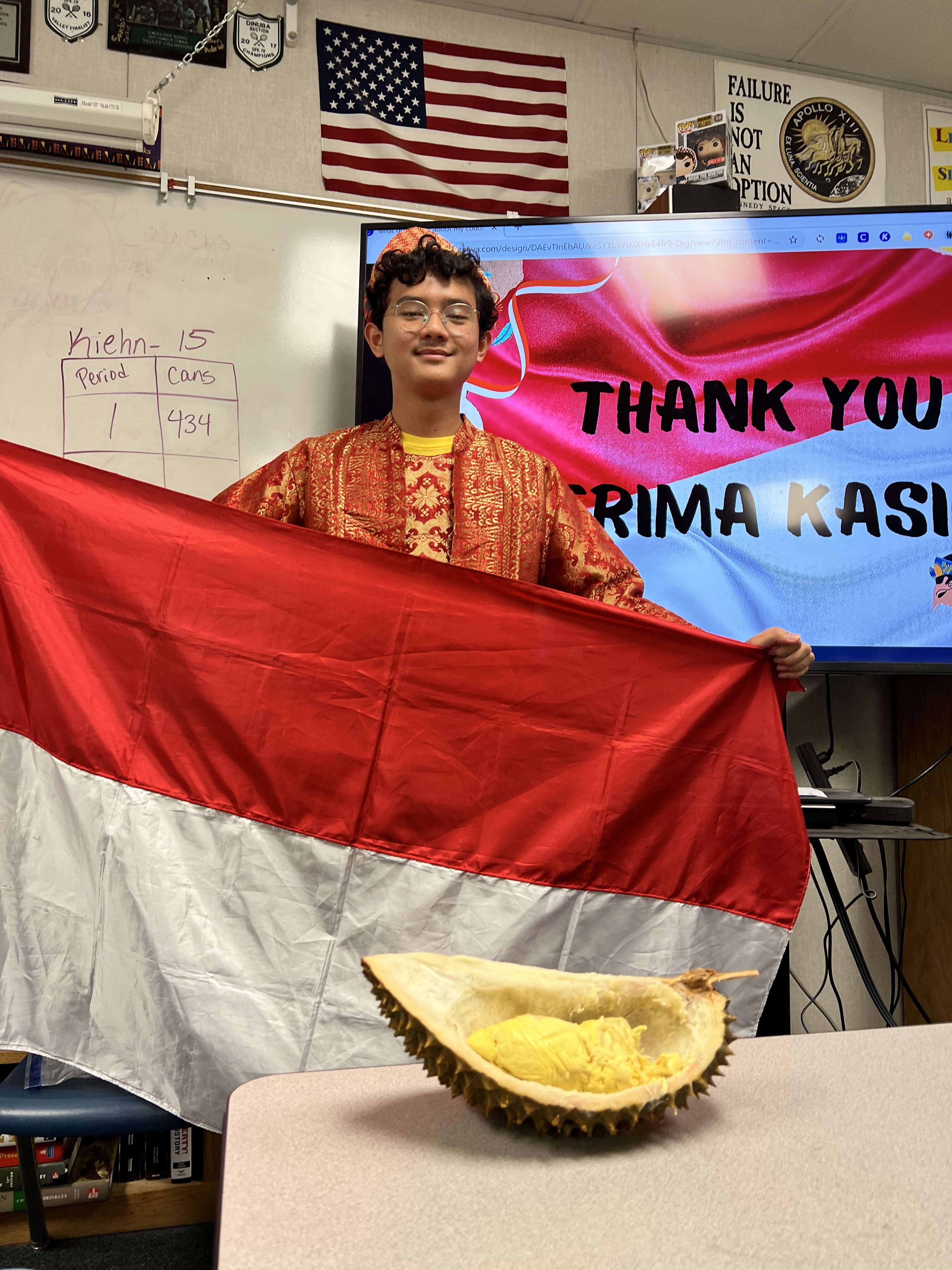 Muhammad holding the Indonesian flag during an IEW presentation 