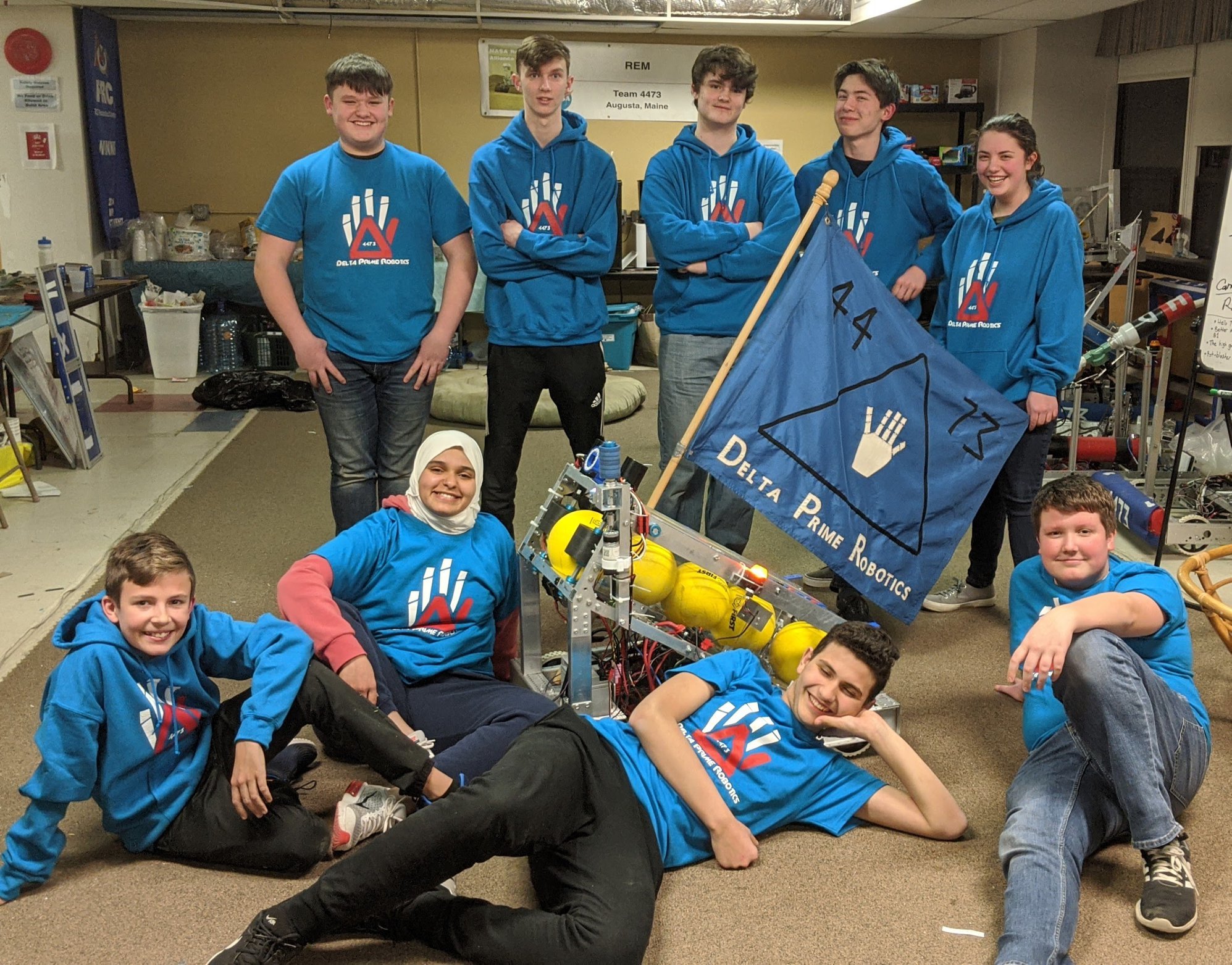 Sana with her robotics team before social distancing restrictions.
