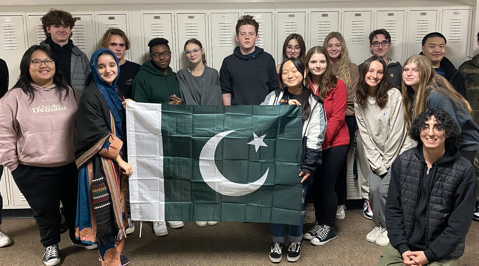 Sahar and her classmates holding the Pakistani flag.