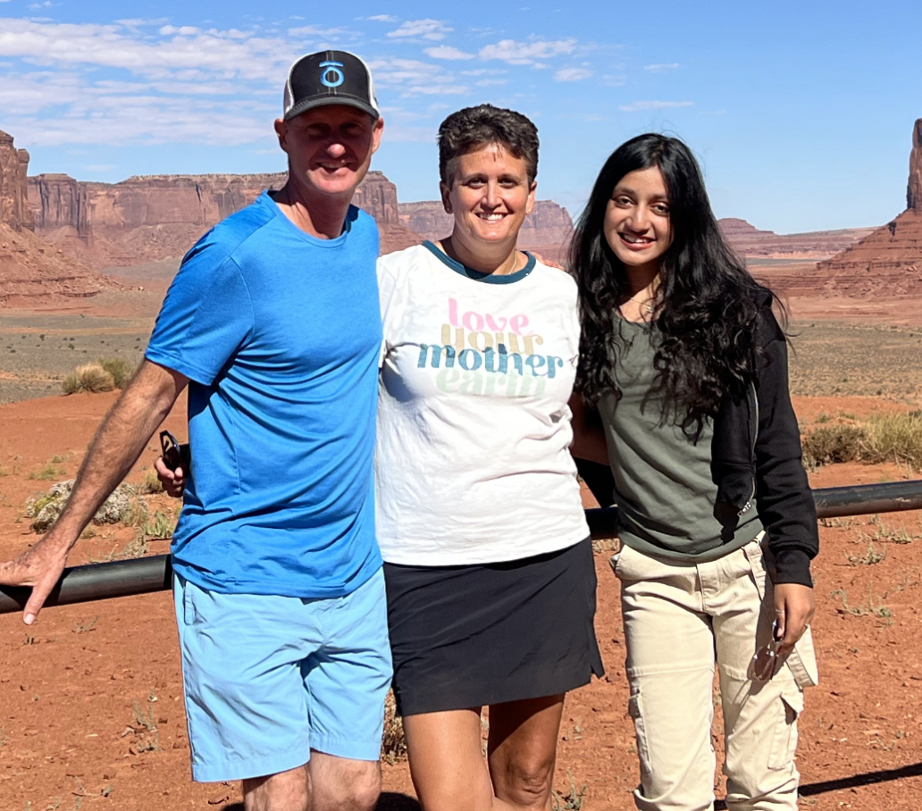 YES student, Shifa standing next to her host parents at monument valley.