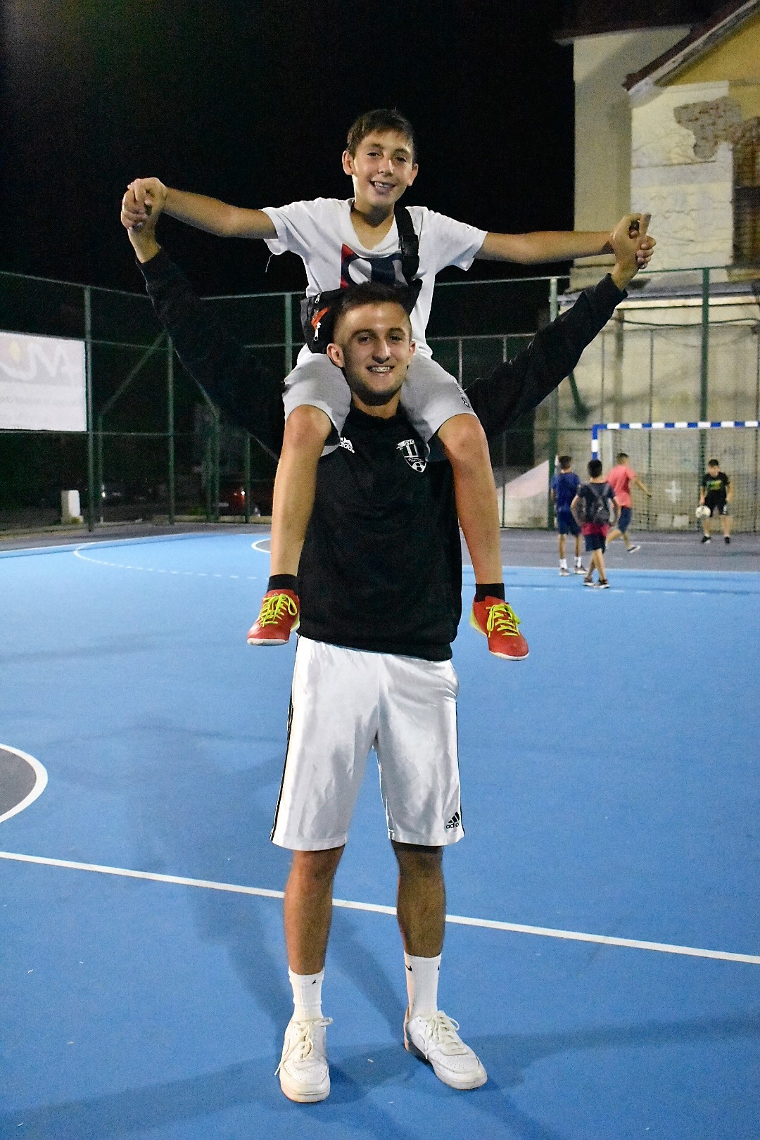 Trajkovski Filip with A Young Fan sitting on his shoulders