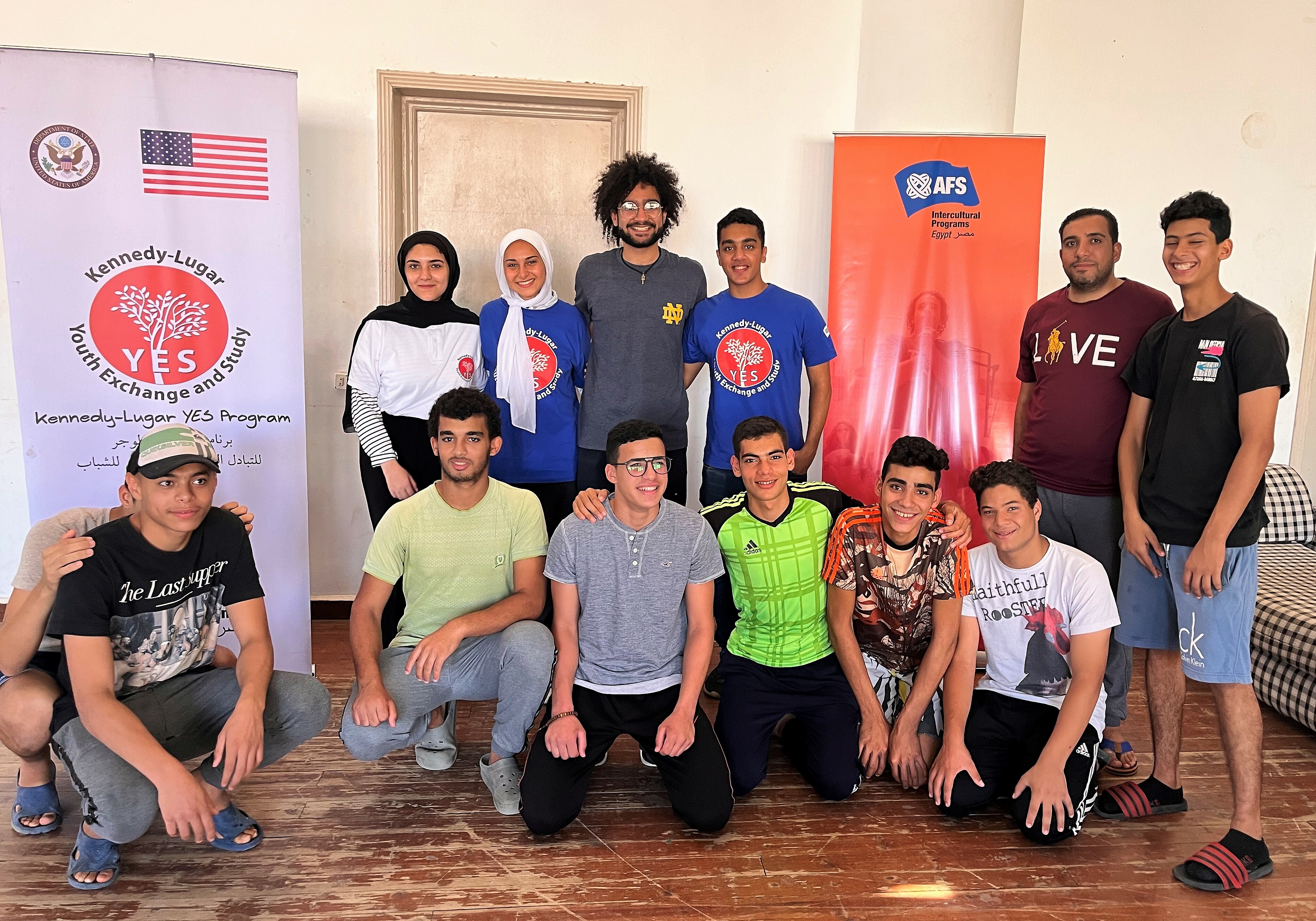 Thirteen People Pose For A Group Photo At A Workshop In Egypt