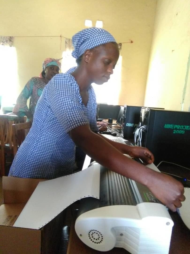 Lukolm Blind Girl Learning How To Mount Paper On A Braille Emboser