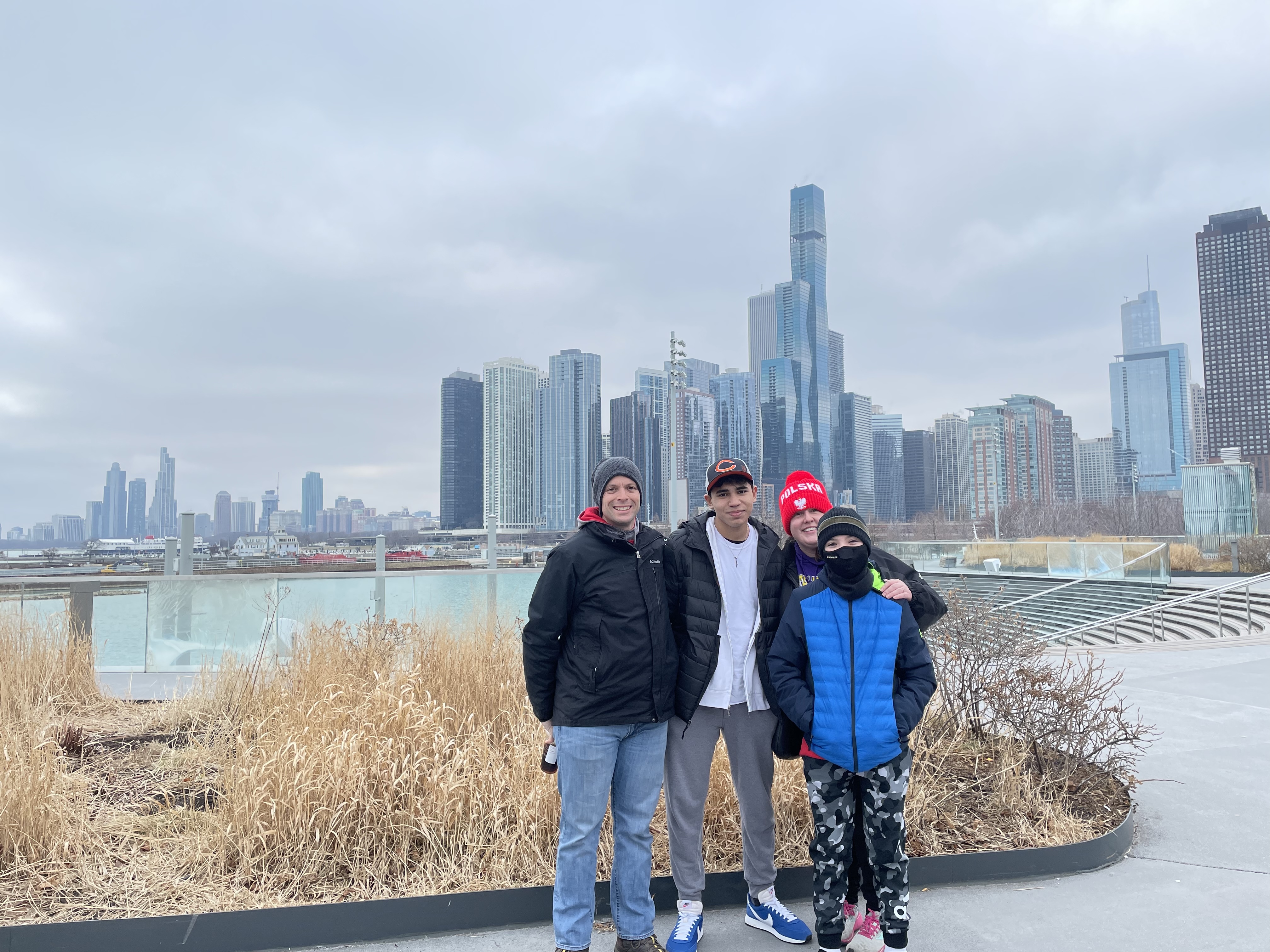 Yazan And His Host Parents And Brother In Front Of The Chicago Skyline