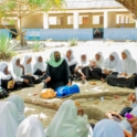 Aysa teaching women how to perform CPR