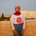 Salma wearing a YES program t-shirt. 