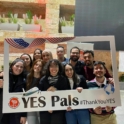Group of students holding a photo frame which reads YES Pals #ThankYouYES