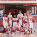 Abdulmuhayman and his basketball team in red and white jerseys