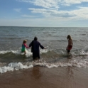 Amina swimming with host family