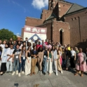 A Large Group Of Youth In Front Of The University Of Pennsylvania Crest