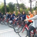 Group of YES alumni on bikes, smiling at the camera