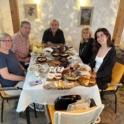 Anea And Her Family Around Dinner Table