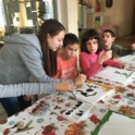 A Bulgarian alumna paints with three children