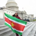 Cheraine Holding The Surinamese Flag In Front Of The Us Capitol