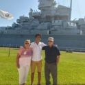 Bishoy and his host family in front of tourist site