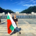 Elitsa holding a Bulgarian flag outside. 