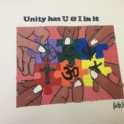 Painting done by YES Alumna Farah that reads "Unity has a U and I in it" 