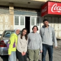 Four Alumni Standing On The Street