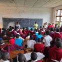 Tanzanian YES alumni leading a session reproductive health to a group of young school girls